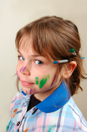 little girl learning to paint. 