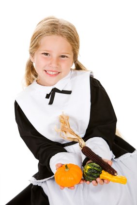 little girl dressed as a pilgrim during show and tell